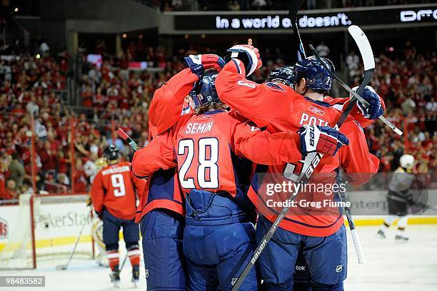 Alexander Semin of the Washington Capitals celebrates with teammates after scoring against the Boston Bruins at the Verizon Center on April 11, 2010...
