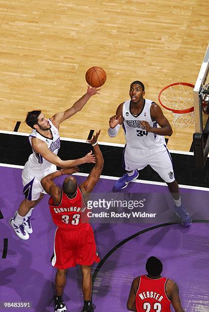 Omri Casspi of the Sacramento Kings shoots a layup against Dante Cunningham of the Portland Trail Blazers during the game at Arco Arena on April 3,...