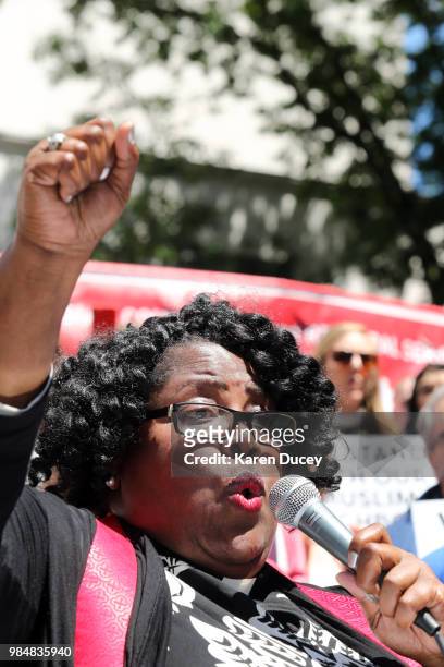 Reverend Dr. Kelle Brown speaks to a crowd outside the William Kenzo Nakamura United States Courthouse who had gathered in reaction to today's...