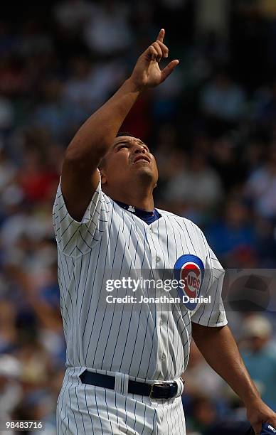 Starting pitcher Carlos Zambrano of the Chicago Cubs, wearing a number 42 jersey in honor of Jackie Robinson, points to the sky after retiring the...