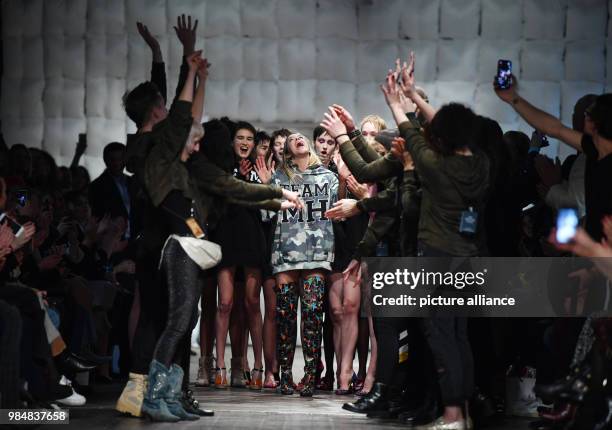 The Austrian fashion designer Marina Hoermanseder runs on the catwalk after the presentation of her label's Autumn/Winter Collection 2018/19 during...