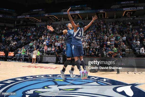 Guard Danielle Robinson and forward Rebekkah Brunson of the Minnesota Lynx celebrate after the game against the Seattle Storm on June 26, 2018 at...