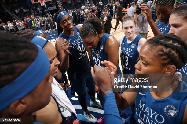 Forward Rebekkah Brunson, center Sylvia Fowles and guard Lindsay Whalen of the Minnesota Lynx all celebrate a victory over the Seattle Storm on June...