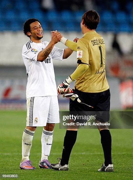 Marcelo of Real Madrid greets Diego Alves of UD Almeria after the La Liga match between UD Almeria and Real Madrid at Estadio del Mediterraneo on...