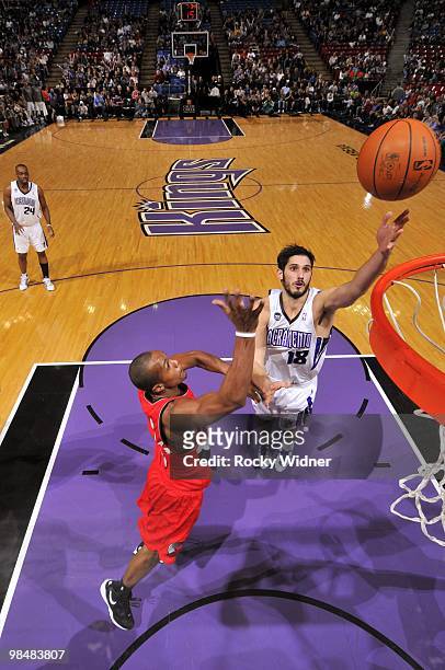 Omri Casspi of the Sacramento Kings shoots a layup against Dante Cunningham of the Portland Trail Blazers during the game at Arco Arena on April 3,...