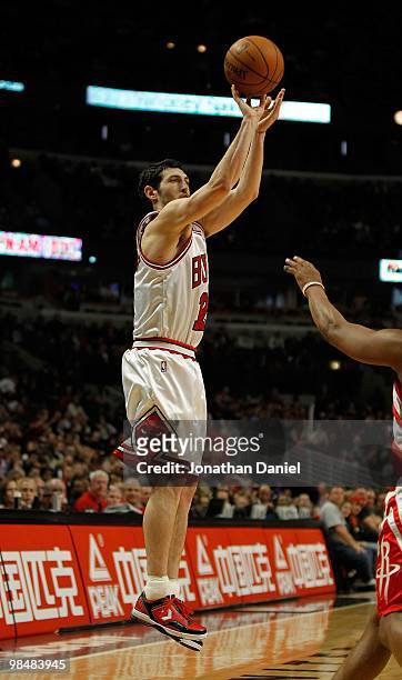 Kirk Hinrich of the Chicago Bulls puts up a three-point shot against the Houston Rockets at the United Center on March 22, 2010 in Chicago, Illinois....