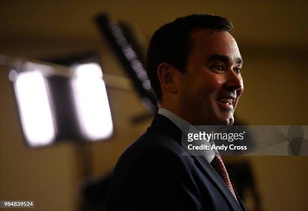 Colorado republican gubernatorial candidate Walker Stapleton smiles during a television interview after his victory speech at the DoubleTree by...