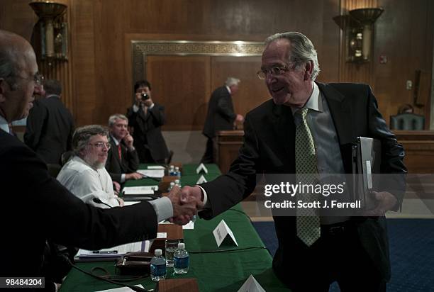 Chairman Tom Harkin, D-Iowa, right, shakes hands with New York City School Chancellor Joel Klein as Robert Balfanz, associate research scientist at...