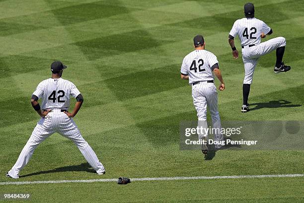Dexter Fowler, Seth Smith and Ryan Spilborghs of the Colorado Rockies warm up prior to facing the New York Mets at Coors Field on April 15, 2010 in...