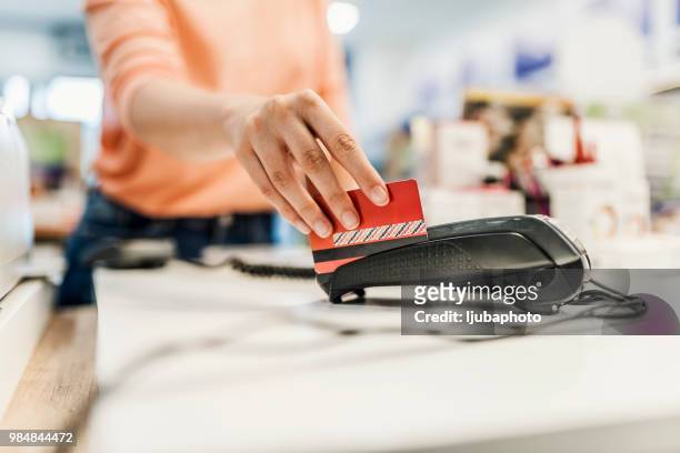 her credit card’s got her shopping covered - swipe stock pictures, royalty-free photos & images