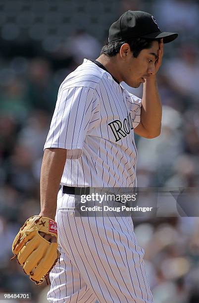 Starting pitcher Jorge De La Rosa of the Colorado Rockies reacts as he works against the New York Mets at Coors Field on April 15, 2010 in Denver,...