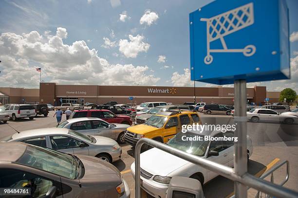Cars sit in the parking lot at Wal-Mart Store No. 1 in Rogers, Arkansas, U.S., on Thursday, April 15, 2010. Wal-Mart Stores Inc., the world's largest...