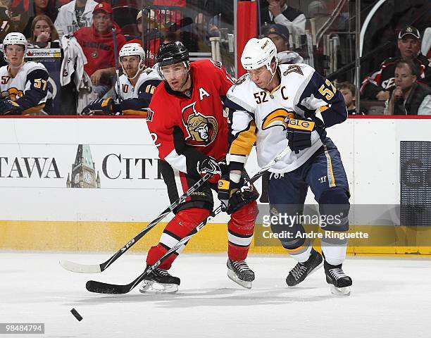 Mike Fisher of the Ottawa Senators and Craig Rivet of the Buffalo Sabres battle for position at Scotiabank Place on April 10, 2010 in Ottawa,...