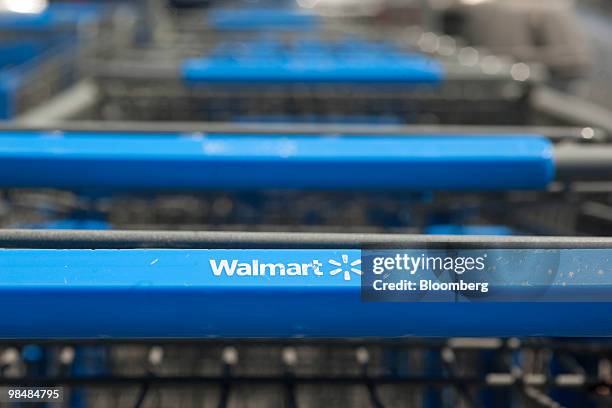 Shopping carts sit at the Wal-Mart Store No. 1 in Rogers, Arkansas, U.S., on Thursday, April 15, 2010. Wal-Mart Stores Inc., the world's largest...