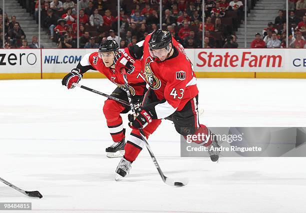 Peter Regin of the Ottawa Senators shoots the puck against the Carolina Hurricanes with Nick Foligno following at Scotiabank Place on April 1, 2010...