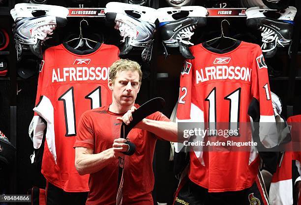 Daniel Alfredsson of the Ottawa Senators tapes his stick in the locker room prior to a game against the Buffalo Sabres at Scotiabank Place on April...