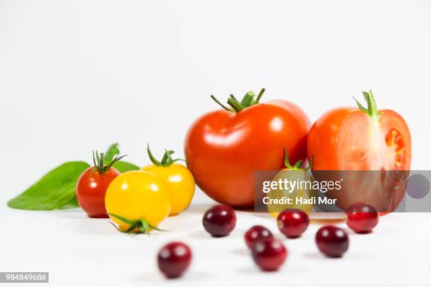 tomatoes, cranberry and spinach. - hadi stock pictures, royalty-free photos & images