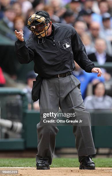 Home plate umpire Dale Scott calls a strike during the game between the Seattle Mariners and the Oakland Athletics at Safeco Field on April 12, 2010...