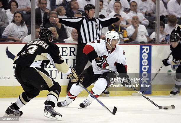 Matt Cullen of the Ottawa Senators handles the puck in front of Alex Goligoski of the Pittsburgh Penguins in Game One of the Eastern Conference...