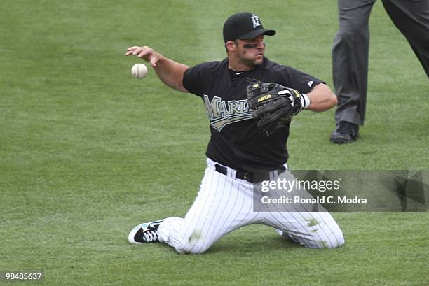 Dan Uggla of the Florida Marlins loses the ball as he gets ready to throw during a MLB game against the Los Angeles Dodgers at Sun Life Stadium on...