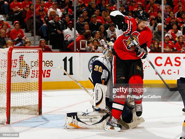 Milan Michalek of the Ottawa Senators sets a screen in front of goaltender Ryan Miller of the Buffalo Sabres during their NHL game at Scotiabank...