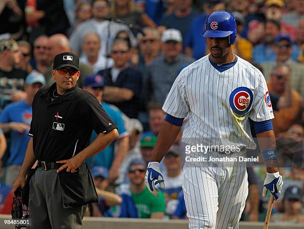 Derrek Lee of the Chicago Cubs, wearing a number 42 jersey in honor of Jackie Robinson, walks to the dugout after being thrown out of a game against...