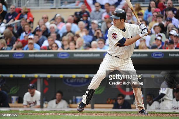 Joe Mauer of the Minnesota Twins bats during the Opening Day game against the Boston Red Sox at Target Field in Minneapolis, Minnesota on April 12,...