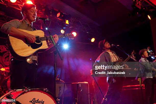 Singer Marcus Mumford, Winston Marshall and Ted Dwane of the British folk-rock band Mumford & Sons perform live during a concert at the Astra...