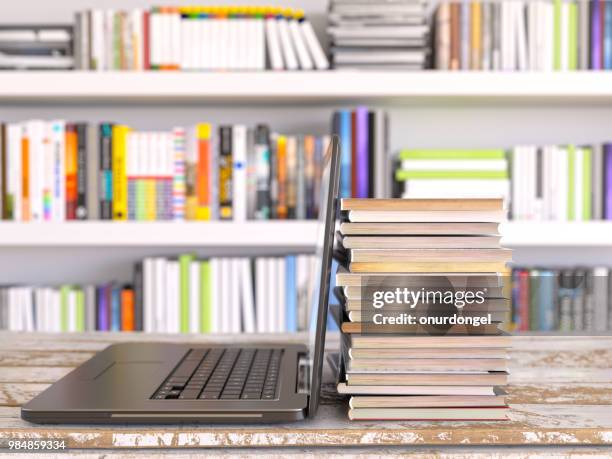 laptop and books in library - enciclopedia stock pictures, royalty-free photos & images