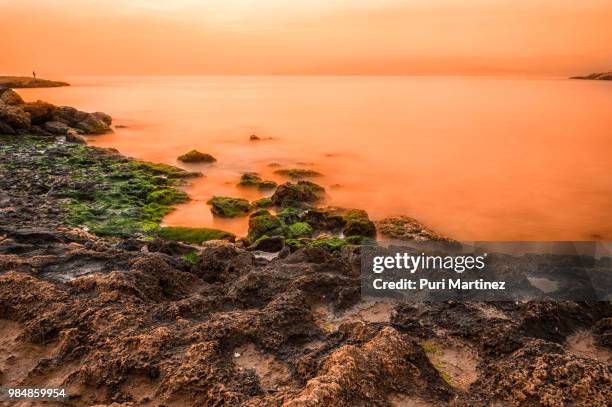 pescador al atardecer - pescador stock pictures, royalty-free photos & images