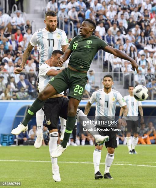 Kenneth Omeruo of Nigeria and Nicolas Otamendi of Argentina vie for the ball during a World Cup Group D match in St. Petersburg, Russia, on June 26,...