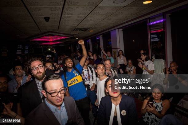Progressive challenger Alexandria Ocasio-Cortez celebrartes with supporters at a victory party in the Bronx after upsetting incumbent Democratic...