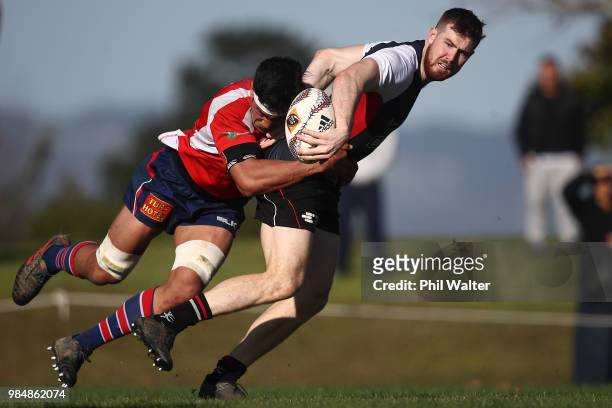 Liam Fitzsimons of Counties Manukau is tackled during the Mitre 10 Cup trial match between Counties Manukau and Tasman at Mountford Park on June 27,...