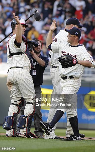 Joe Mauer and Michael Cuddyer of the Minnesota Twins celebrate a Twins win against the Boston Red Sox during the Twins home opener at Target Field on...