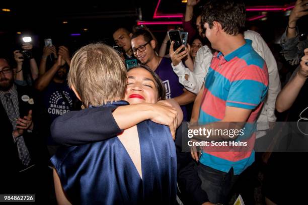 Progressive challenger Alexandria Ocasio-Cortez embraces New York gubenatorial candidate Cynthia Nixon at her victory party in the Bronx after...