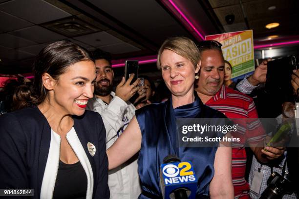 Progressive challenger Alexandria Ocasio-Cortez is joined by New York gubenatorial candidate Cynthia Nixon at her victory party in the Bronx after...