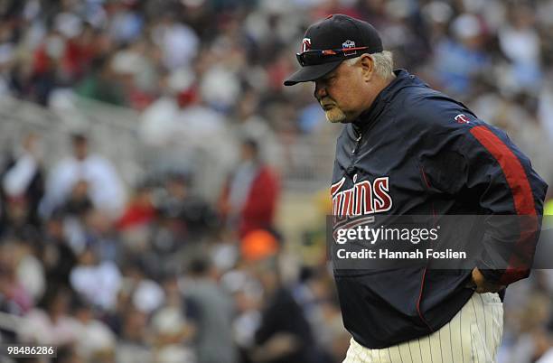 Manager Ron Gardenhire of the Minnesota Twins returns to the dugout after a pitching change in the eighth inning against the Boston Red Sox during...