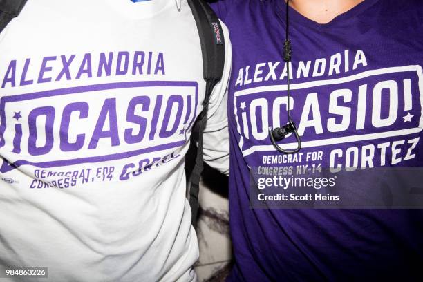 Suporters of progressive challenger Alexandria Ocasio-Cortez celebrate at her victory party in the Bronx after an upset against incumbent Democratic...