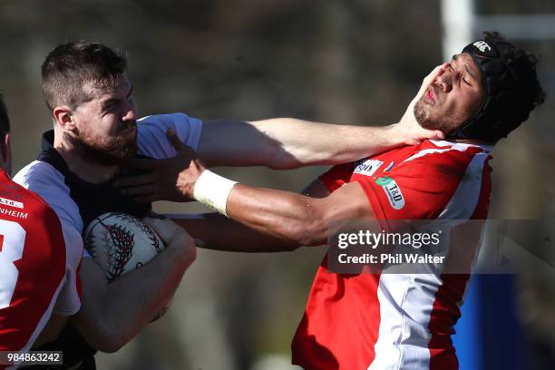 Liam Fitzsimons of Counties Manukau fends off Mike Vaeno of Tasman during the Mitre 10 Cup trial match between Counties Manukau and Tasman at...