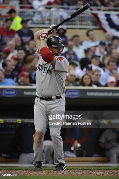 Kevin Youkilis of the Boston Red Sox bats in the sixth inning against the Minnesota Twins during the Twins home opener at Target Field on April 12,...