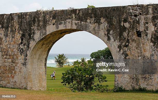 Amanda Blumenherst of the United States and her caddie walk up the first fairway during the second round of The Mojo 6 Jamaica LPGA Invitational at...