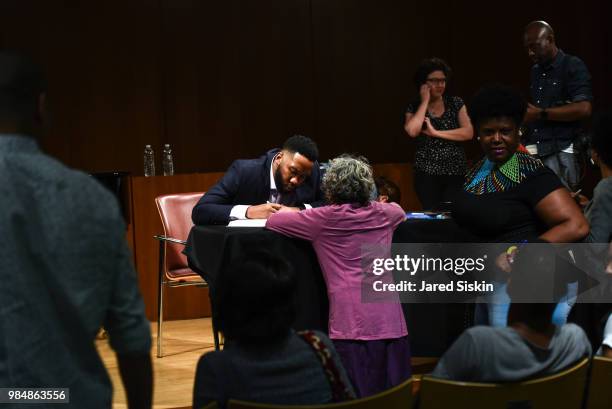 Ndaba Mandela signs a copy of his book at after In Conversation With Lydia Polgreen, Editor-in-Chief, HuffPost and Ndaba Mandela, Grandson Of Nelson...