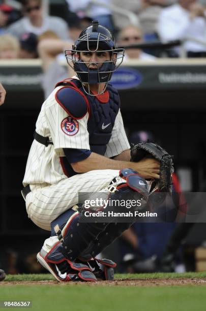 Joe Mauer of the Minnesota Twins in the third inning against the Boston Red Sox during the Twins home opener at Target Field on April 12, 2010 in...