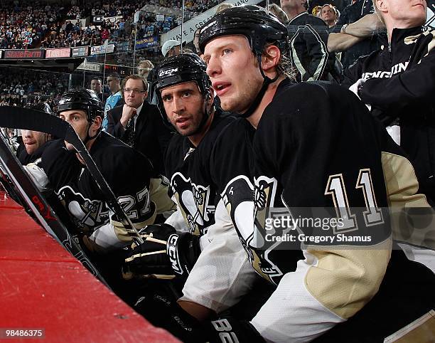 Jordan Staal and Maxime Talbot of the Pittsburgh Penguins talk on the bench against the New York Islanders on April 8, 2010 at the Mellon Arena in...