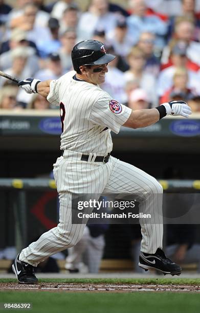 Nick Punto of the Minnesota Twins bats in the second inning against the Boston Red Sox during the Twins home opener at Target Field on April 12, 2010...