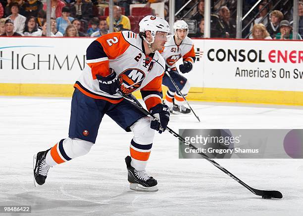 Mark Streit of the New York Islanders moves the puck up ice against the Pittsburgh Penguins on April 8, 2010 at the Mellon Arena in Pittsburgh,...