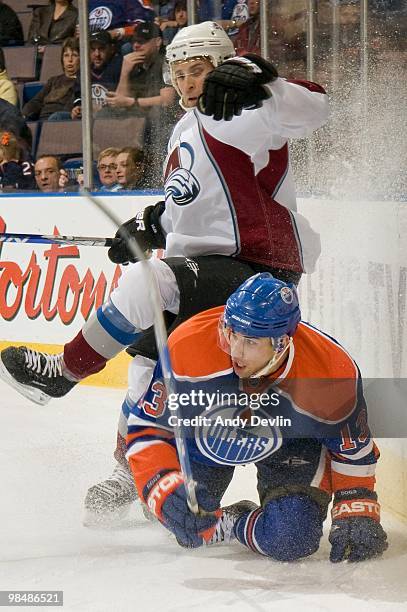 Andrew Cogliano of the Edmonton Oilers watches the puck from his knees against the Colorado Avalanche at Rexall Place on April 7, 2010 in Edmonton,...