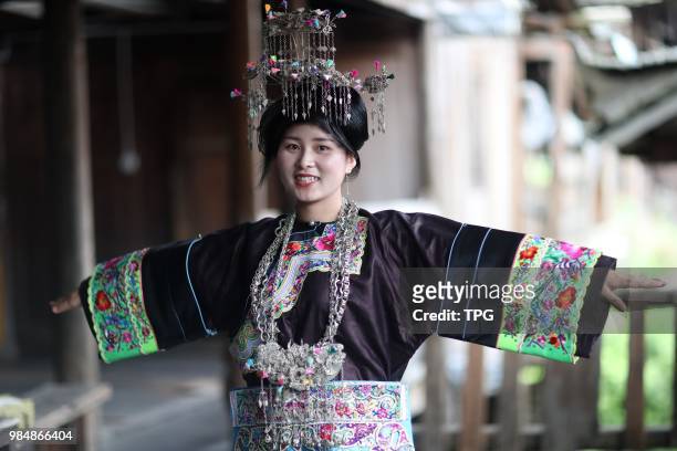 The beautiful Dong girls wearing traditional clothes and headwear on 26 June 2018 in Rongjiang,Guizhou, China.