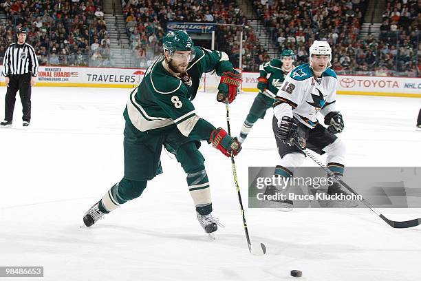Brent Burns of the Minnesota Wild passes the puck against the San Jose Sharks during the game at the Xcel Energy Center on April 2, 2010 in St. Paul,...