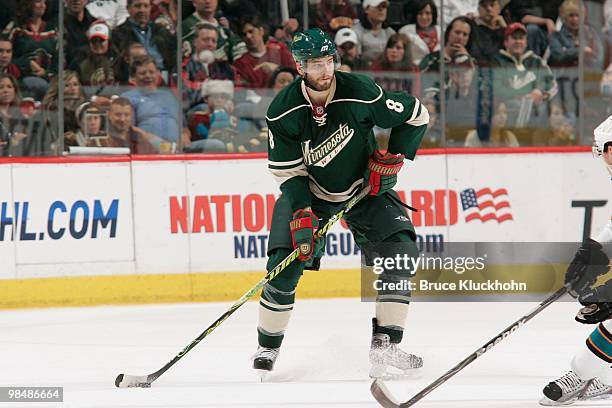 Brent Burns of the Minnesota Wild looks to deliver a pass against the San Jose Sharks during the game at the Xcel Energy Center on April 2, 2010 in...